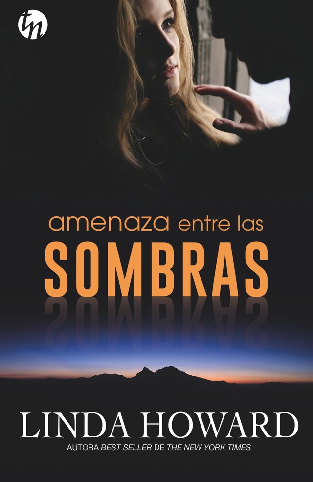 Book cover for Amenaza entre las sombras